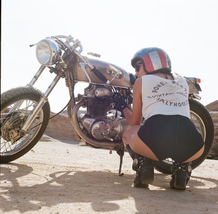A playful frame from Girls on a motorcycle — online in Wellington